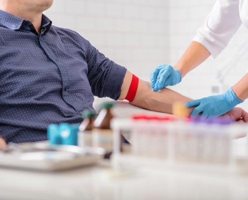 Nurse taking blood sample