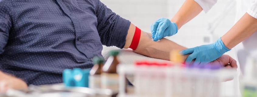 Nurse taking blood sample
